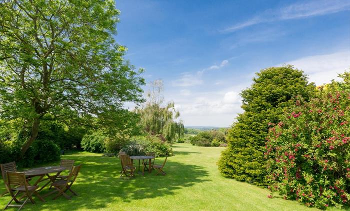 Gardens at Ty'n Rhos country house with views over to the Isle of Anglesey